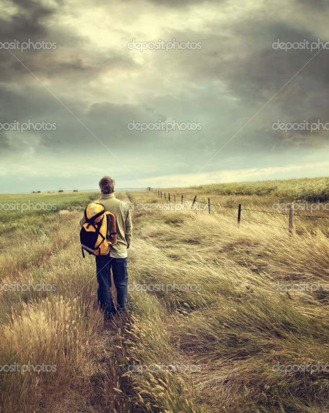 Man walking down country road